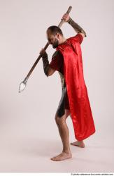 Man Adult Average White Fighting with spear Standing poses Casual